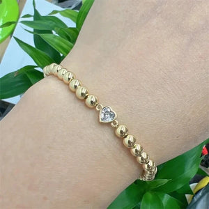 BRACELET: GOLD BEAD CIRCLE HEART STONE